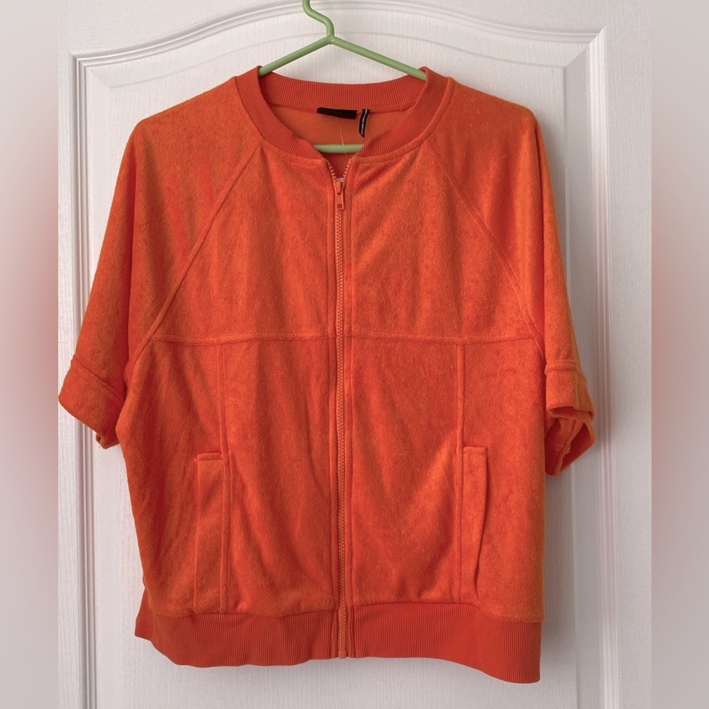 Out From Under by Urban Outfitters. Size small. Orange zip up short sleeve. NWT